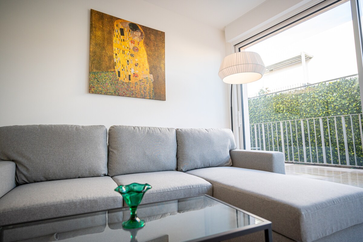 Comfortable sofa with Klimt artwork