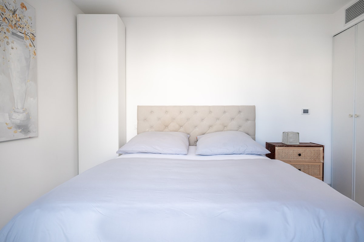 Queen bed with tufted headboard