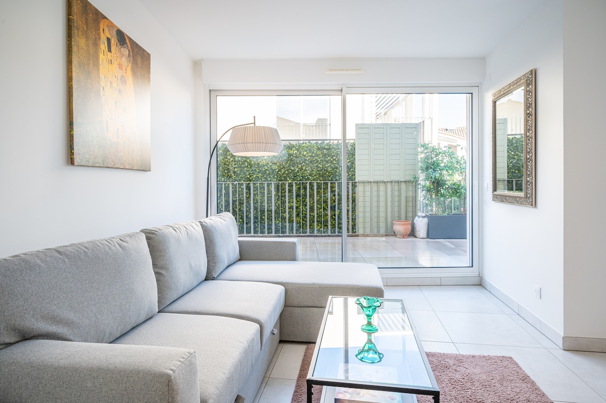 Bright living room with sofa and balcony access