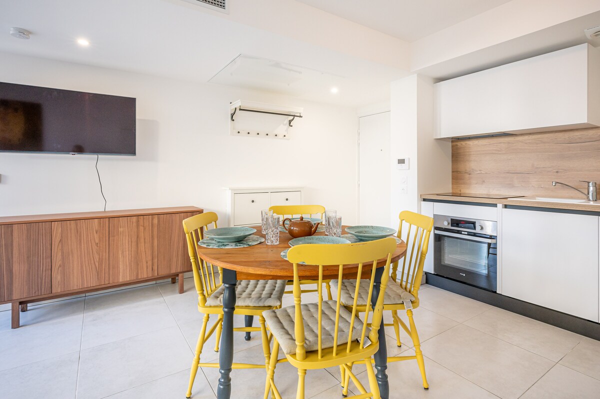 Open-plan dining and kitchen with table set