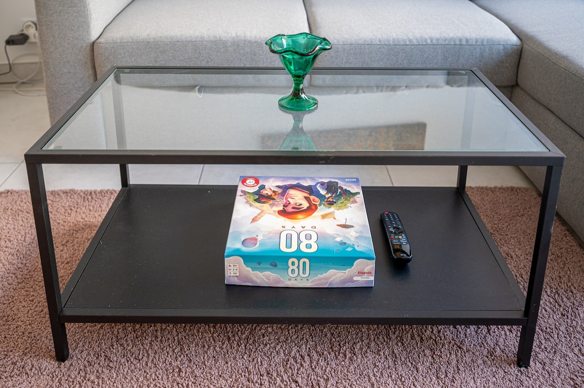 Coffee table with board game and remote