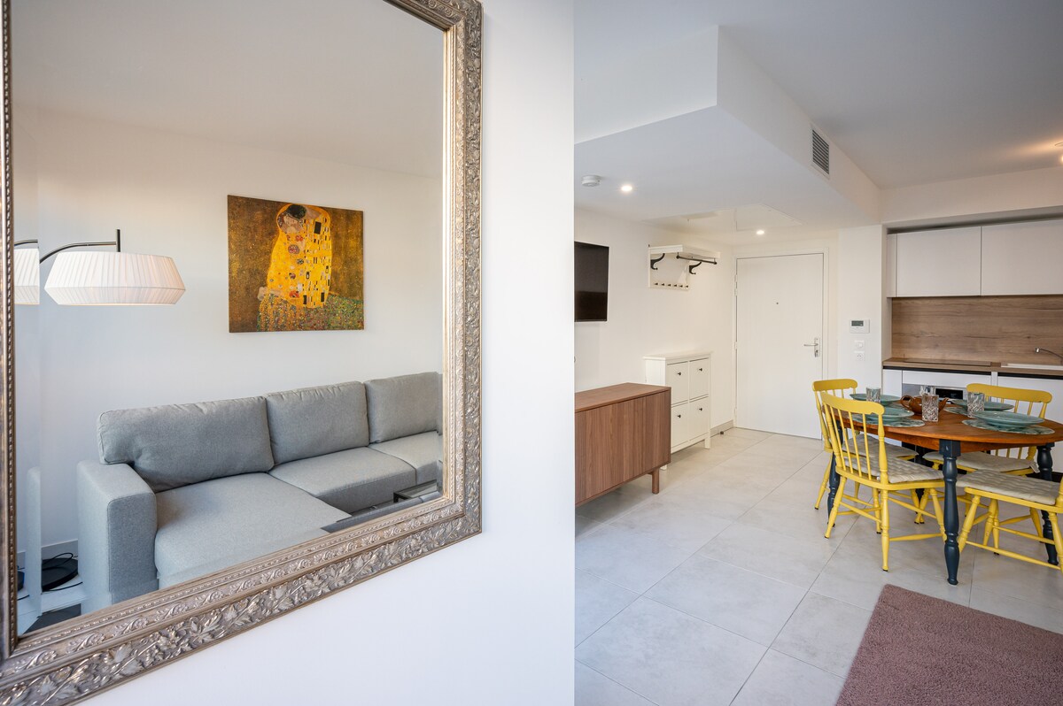 Mirror reflection of living room and kitchen