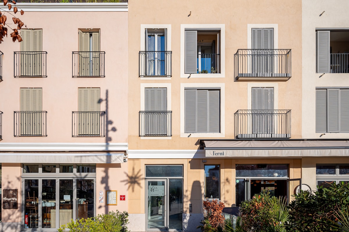 Building facade with Provencal shutters