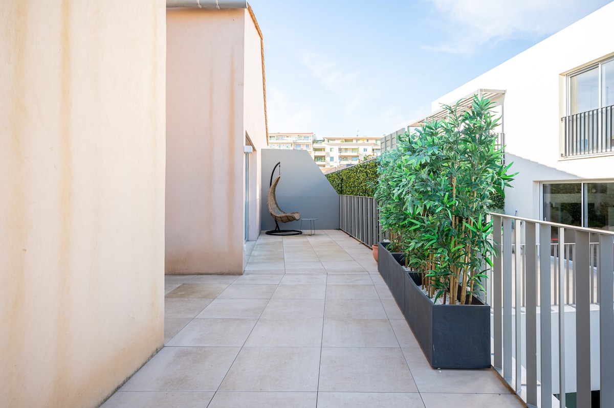 Spacious terrace with plants and city views