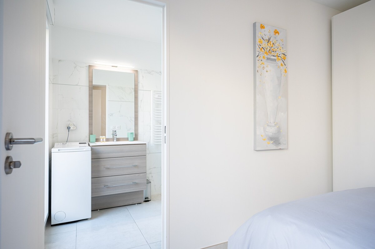 Bathroom entrance with floral artwork