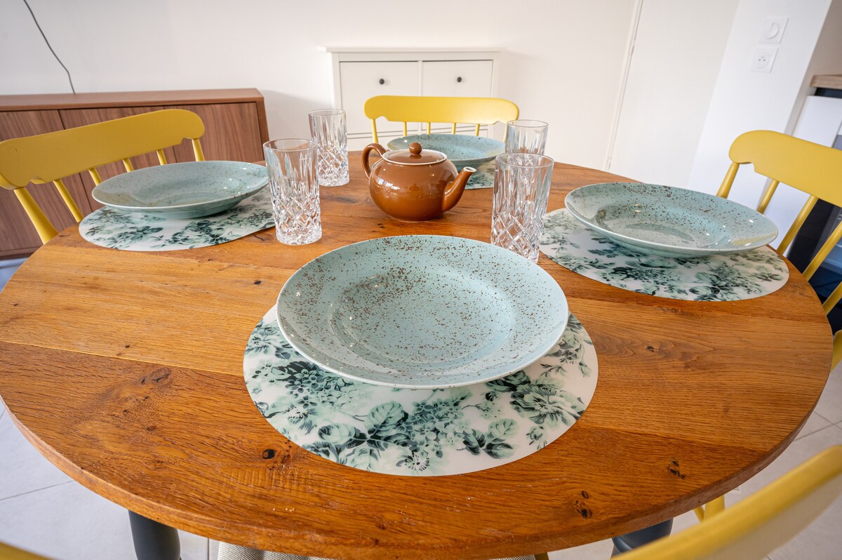 Dining table set with ceramic plates and teapot
